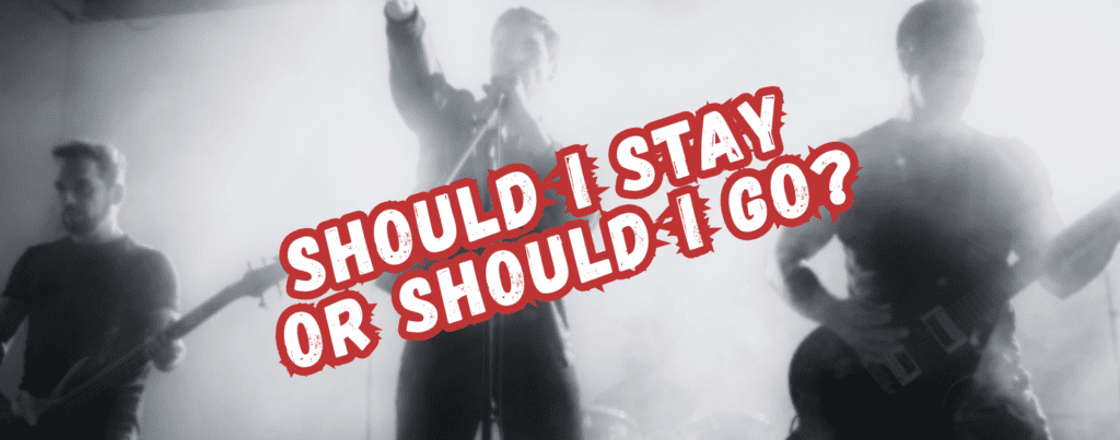 A black and white photo of a rock band performing on stage, with bold red and white text across the image that reads, SHOULD I STAY OR SHOULD I GO?.